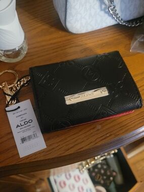 Amazon Black Wallet with Red Trim and Gold Plate